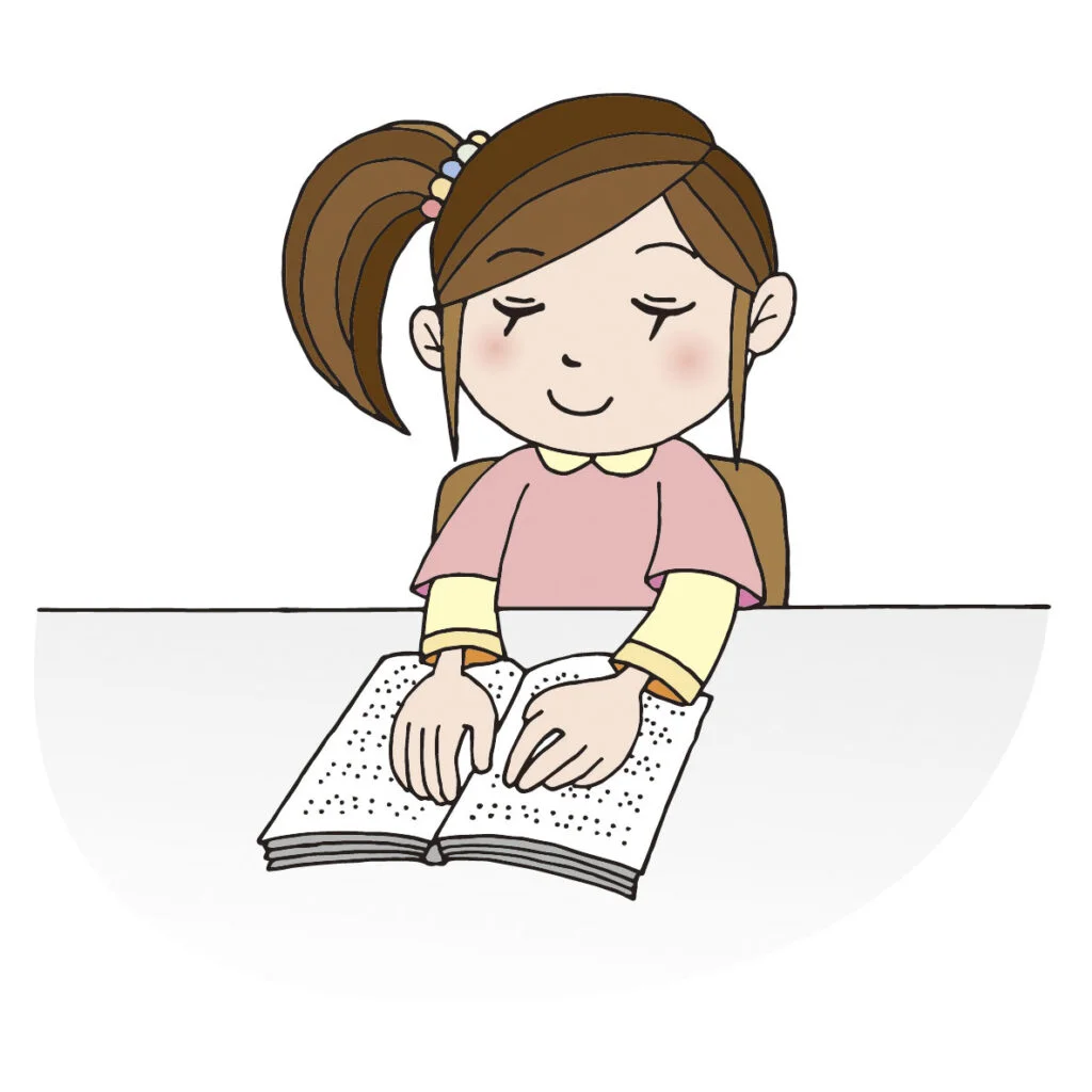 点字の本を読んでいる女の子。